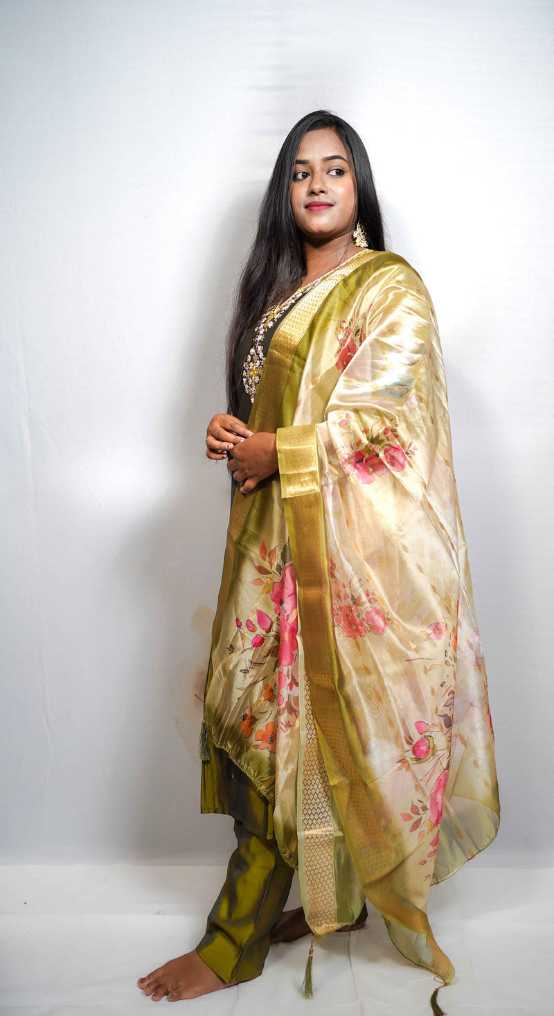 This is a gorgeous festive piece — that olive-green silk with the embroidered yoke and the floral Banarasi dupatta is very Puja-ready